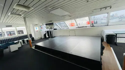 A stage set up inside of a large boat