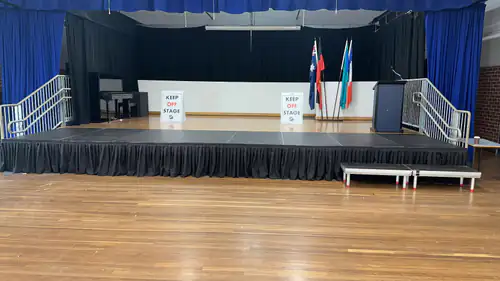 A freshly set up stage inside an large hall