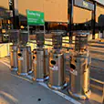Stainless steel outdoor area heaters lined up outside a shopping centre entrance for event and winter heating use