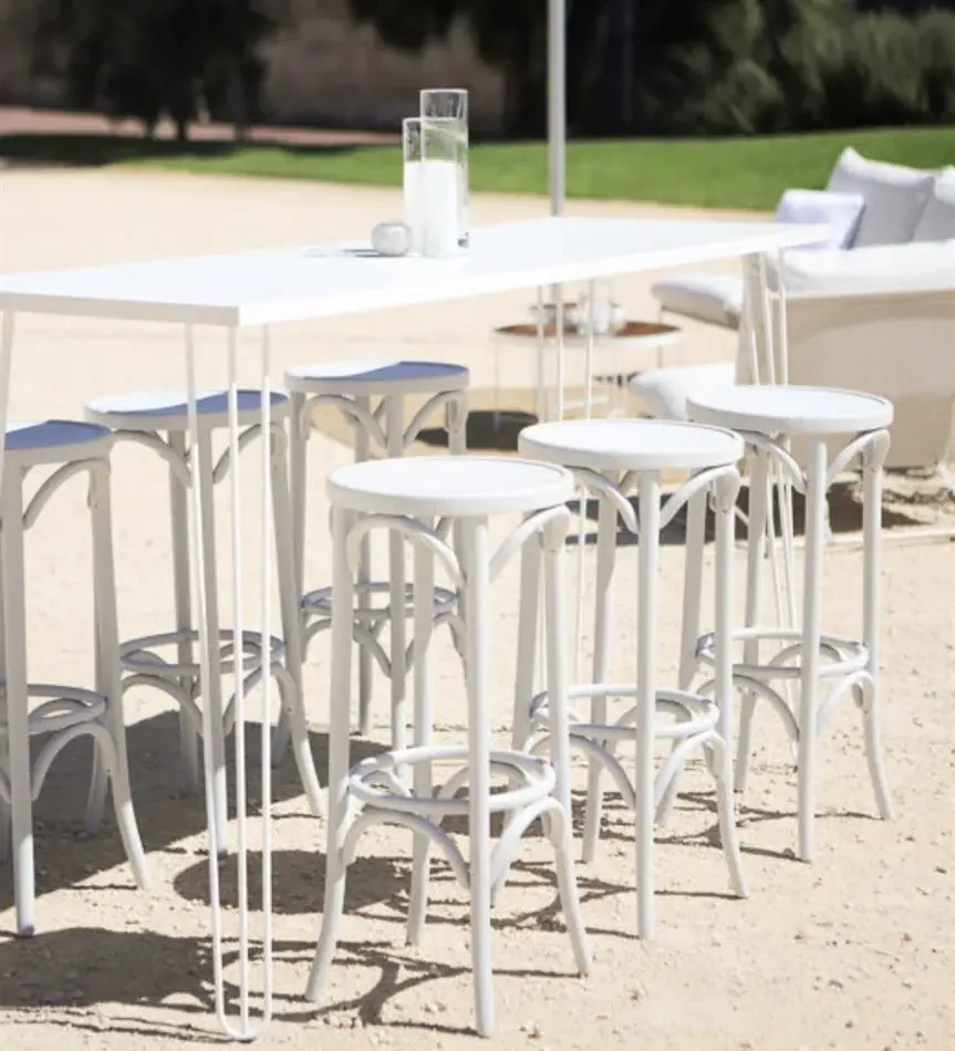 White thonet bentwood stool styled at a coastal event alongside high bar tables and wine barrels