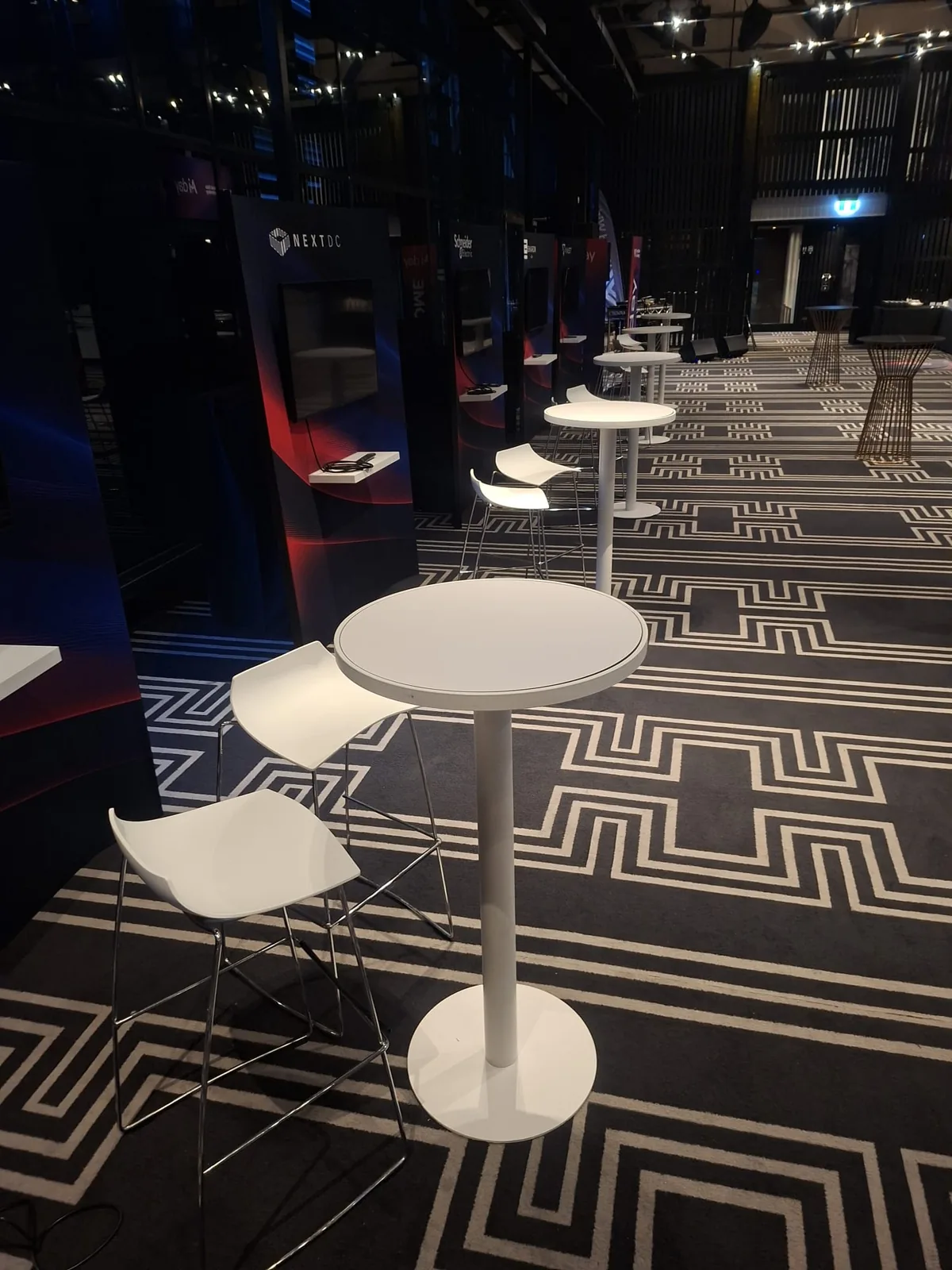 White hairpin bar table and stools set up for an event at Doltone House