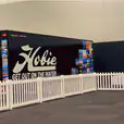 Hire a booth with a white picket fence in front of it for your event.