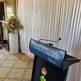 White silk draping framing an elegant indoor event entrance