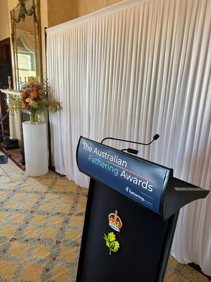 White silk draping framing an elegant indoor event entrance