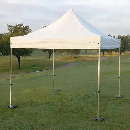 White three by three metre pop up marquee without walls set up on open grass with a peaked roof, slim frame legs and weighted feet