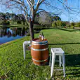 A scenic shot of our wine barrel being hired for an outdoor event