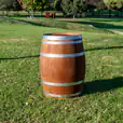 A beautiful classic wine barrel on a grass area